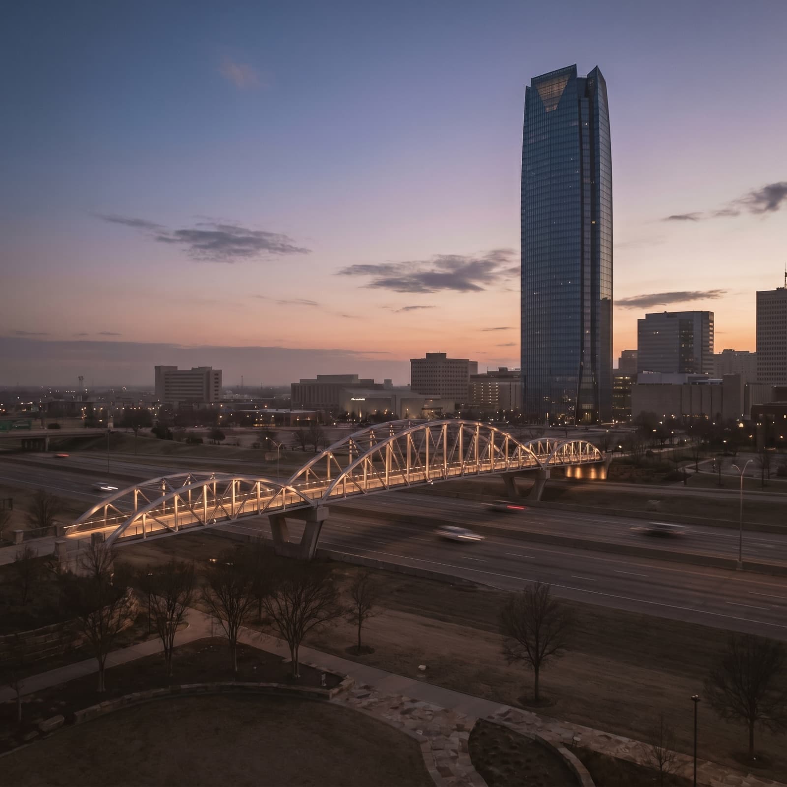 Oklahoma City, OK — Skydance Bridge with the Devon Tower skyline at dusk