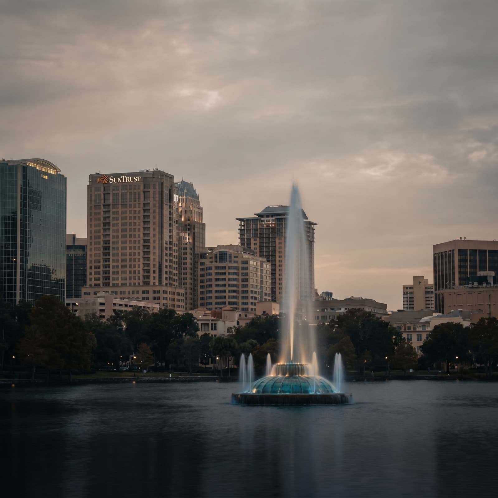Orlando, FL — Lake Eola fountain with the downtown Orlando skyline at dusk